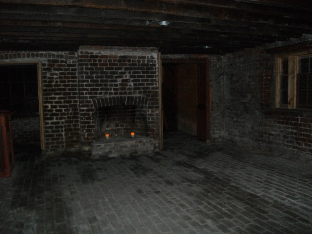 In the basement where the kitchens used to be and where the slaves slept.